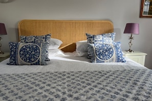 The en-suite bedroom has a super comfy bed and views of the stream and gardens.