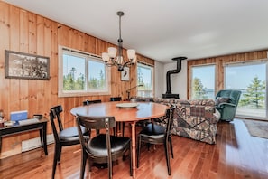 Sunny dining area with beautiful lake views — ideal for family meals, game nights, and gathering after a day of exploring.