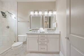 Private Master Suite Bath with oversized step in shower, double sinks and plenty of towels. 