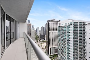 Enjoy breathtaking city views from your private balcony, accessible from both the living room and bedroom.