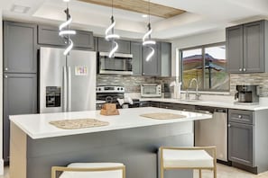Fully equipped kitchen with modern appliances.
