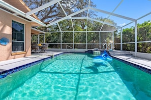 Enjoy the best of outdoor living with our beautiful screened-in pool and patio area, designed to let you soak up the Florida sunshine while staying cool, comfortable, and protected.