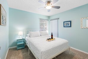This inviting bedroom features a plush queen-size bed, offering a spacious and cozy sleeping experience for solo travelers, couples, or anyone seeking a peaceful night's rest.