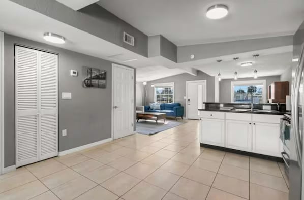 Fully equipped kitchen with modern appliances.