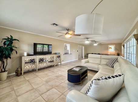Our expansive rear living room has an abundance of seating and cozy nooks, as well as a comfortable couch with recliners.