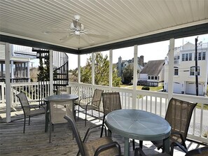 Open-air deck with a dining set, great for outdoor meals with a view.