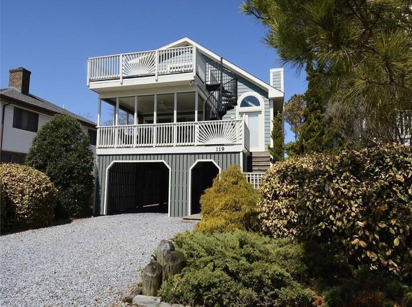 Stunning beach house with a spacious wraparound deck, perfect for enjoying ocean breezes.