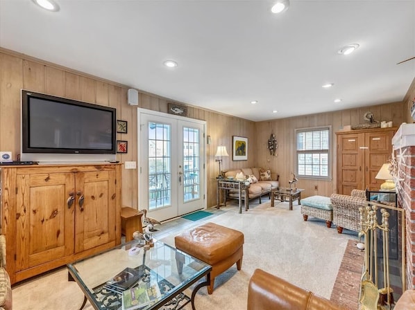 The entertainment area offers a flat-screen TV and a comfortable layout for movie nights and family gatherings.