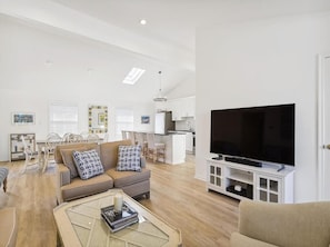 This bright and airy space connects to the kitchen, enhancing the home's flow and making it an entertainer's dream.