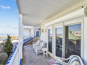 This inviting balcony area offers gorgeous ocean vistas and a perfect space to unwind in the fresh coastal air.