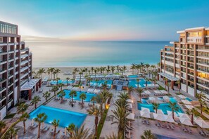 8 luxury beach front pools with a waiter service and pool side grill