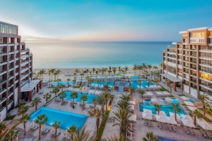 8 luxury beach front pools with a waiter service and pool side grill