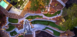 A shared 9 hole mini golf course is nestled right into the hillside—perfect for casual games with a view.