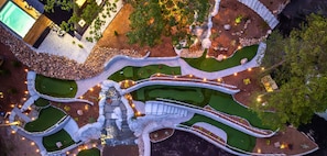 A shared 9 hole mini golf course is nestled right into the hillside—perfect for casual games with a view.