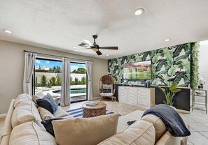 Comfortable living space with sliders to backyard