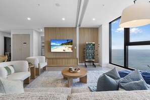 Enjoy luxury comfortability with this tastefully decorated living room and Bluey Ocean views