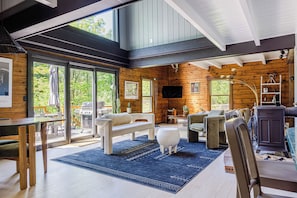 Modern comfort meets rustic charm with high ceilings and natural light. (Cottage)
