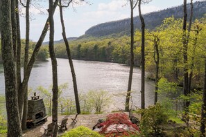 Your private oasis, comprised of terraced garden, outdoor fireplace and lake beyond.