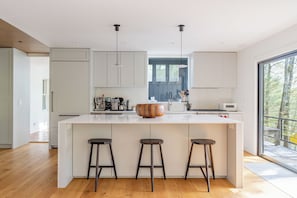 The chef's kitchen is filled with light.
