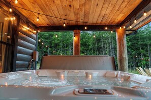 Enjoy a relaxing soak in the inviting hot tub, perfect for unwinding after a long day.