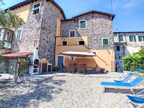 Wall, Home, Urban Design, Apartment, Balcony, Cobblestone, Courtyard, Outdoor Furniture, Houseplant, Flagstone