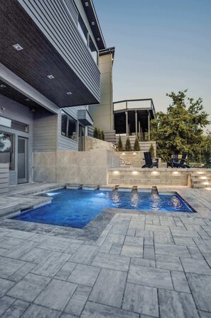 Backyard: Unwind and soak up the good times in our beautifully lit pool area. Backyard and pool is shared with guests staying in the first floor unit.