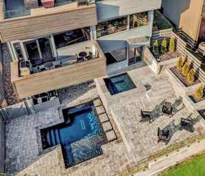 Backyard: Unwind and soak up the good times in our beautifully lit pool area. Backyard and pool is shared with guests staying in the first floor unit.