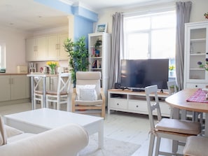 Furniture, Interior Design, Flooring, Wood, Floor, Table, Room, Living Room, Lighting, Ceiling