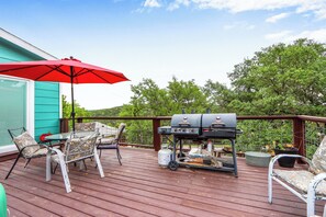 Grill on the back deck with covered seating