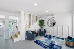 This stylish foyer greets you on the first floor entry