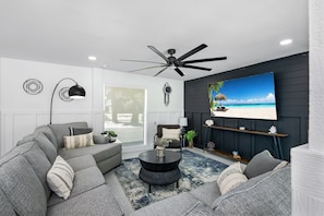 Open concept living room with lots of natural lighting