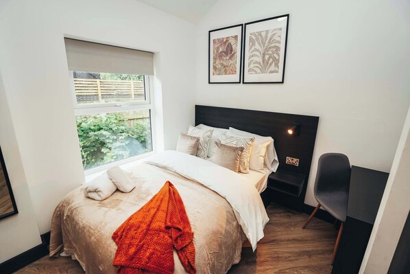 Comfortable bed with fresh linens, soft lighting, and peaceful vibes for a great night’s sleep.