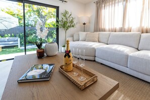 Relax in our bright, elegant living room, perfect for unwinding or watching TV.