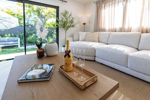 Relax in our bright, elegant living room, perfect for unwinding or watching TV.