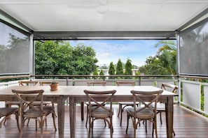 Enjoy alfresco dining at home on the undercover balcony. A large outdoor dining table makes it easy to sit down for a shared meal.
