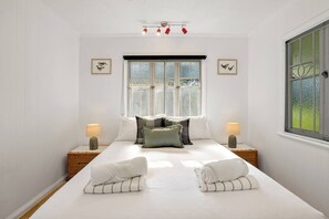 The third bedroom comes with a queen-sized bed, air-conditioning and an open private bathroom.
