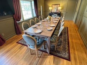 Seats up to 12 for Corporate Meetings or Larger Dinners (slide couch away)