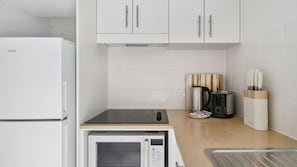 Clean and functional kitchen with contemporary appliances and plenty of space.