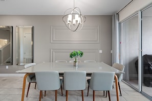 Our dining area comfortably seats up to 8 guests, with 4 additional seats available at the kitchen island.