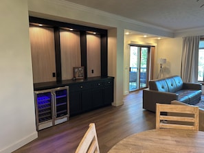Living room bar with beverage fridge