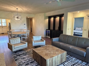 Living room with leather couch and chairs seating