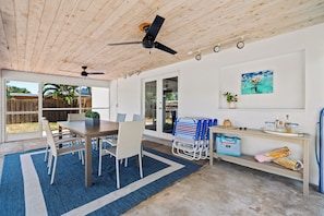 This screened in patio will be the scene of many fun dinners, board game challenges, puzzles and morning coffees.