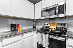 The kitchen invites you to experiment with new recipes, offering a stylish and practical space to cook and create.