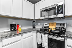 The kitchen invites you to experiment with new recipes, offering a stylish and practical space to cook and create.