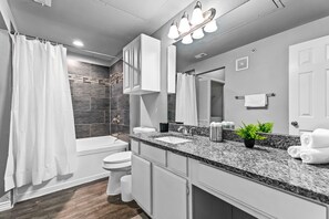 You feel a sense of calm as you enter the bathroom, where the thoughtful design and high-quality materials create a serene environment.