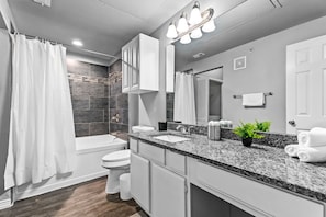 You feel a sense of calm as you enter the bathroom, where the thoughtful design and high-quality materials create a serene environment.