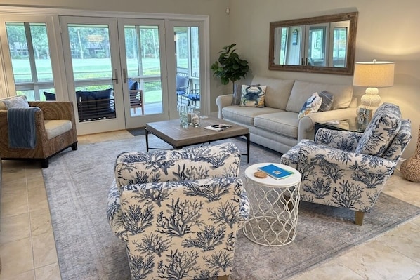 Living area with lagoon/golf view and ample seating to enjoy family and friends