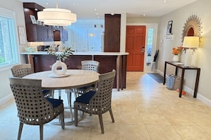 Plenty of dining space with table for four (option for 6) and bar stools