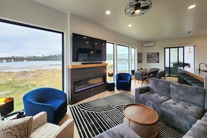 Sit back and relax with views, electric fireplace and large television.