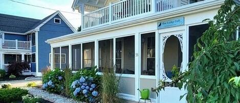 Your vacation rental has a screened in porch with this charming cottage.